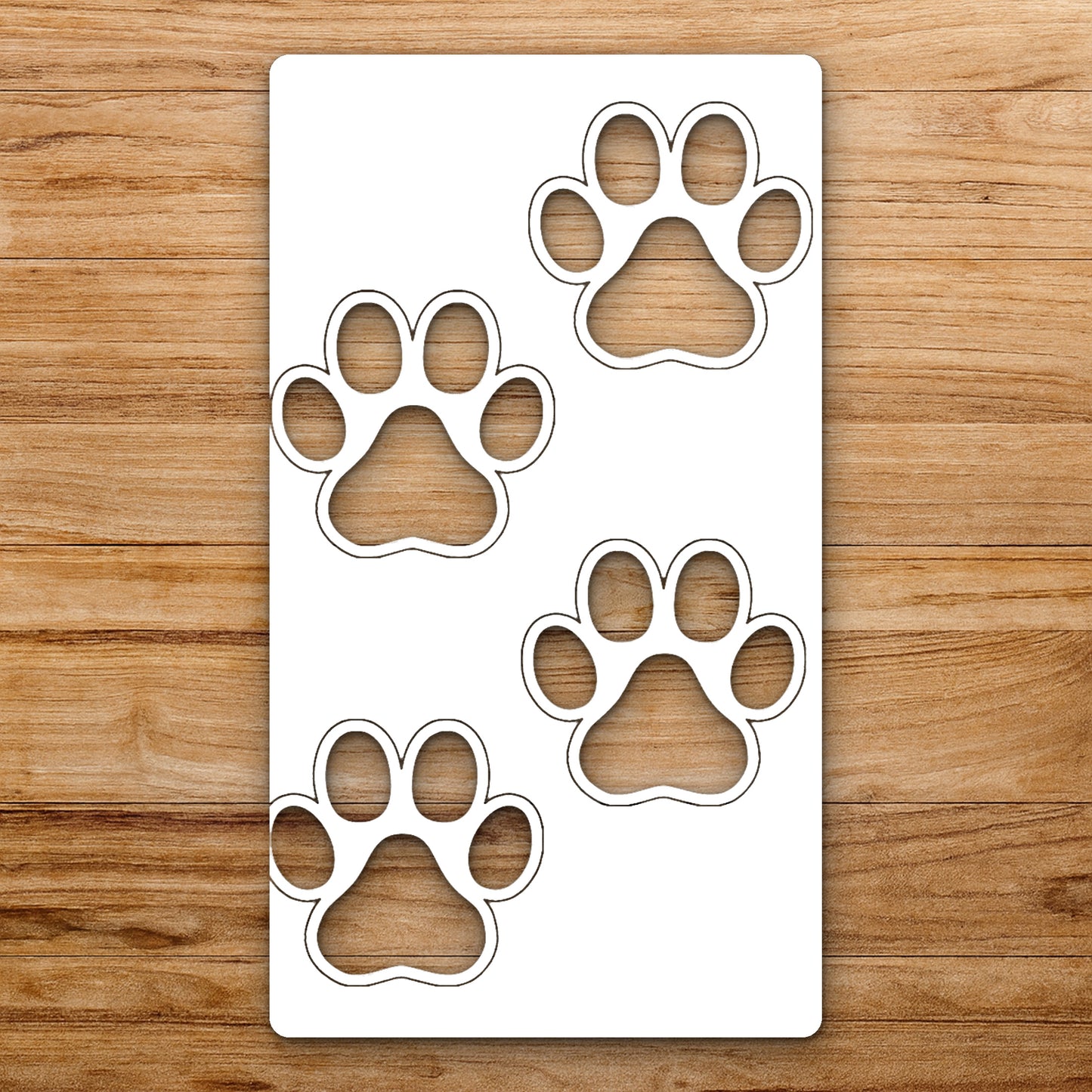 Four Paw Prints Arranged In Scattered reusable Mylar wall painting stencil