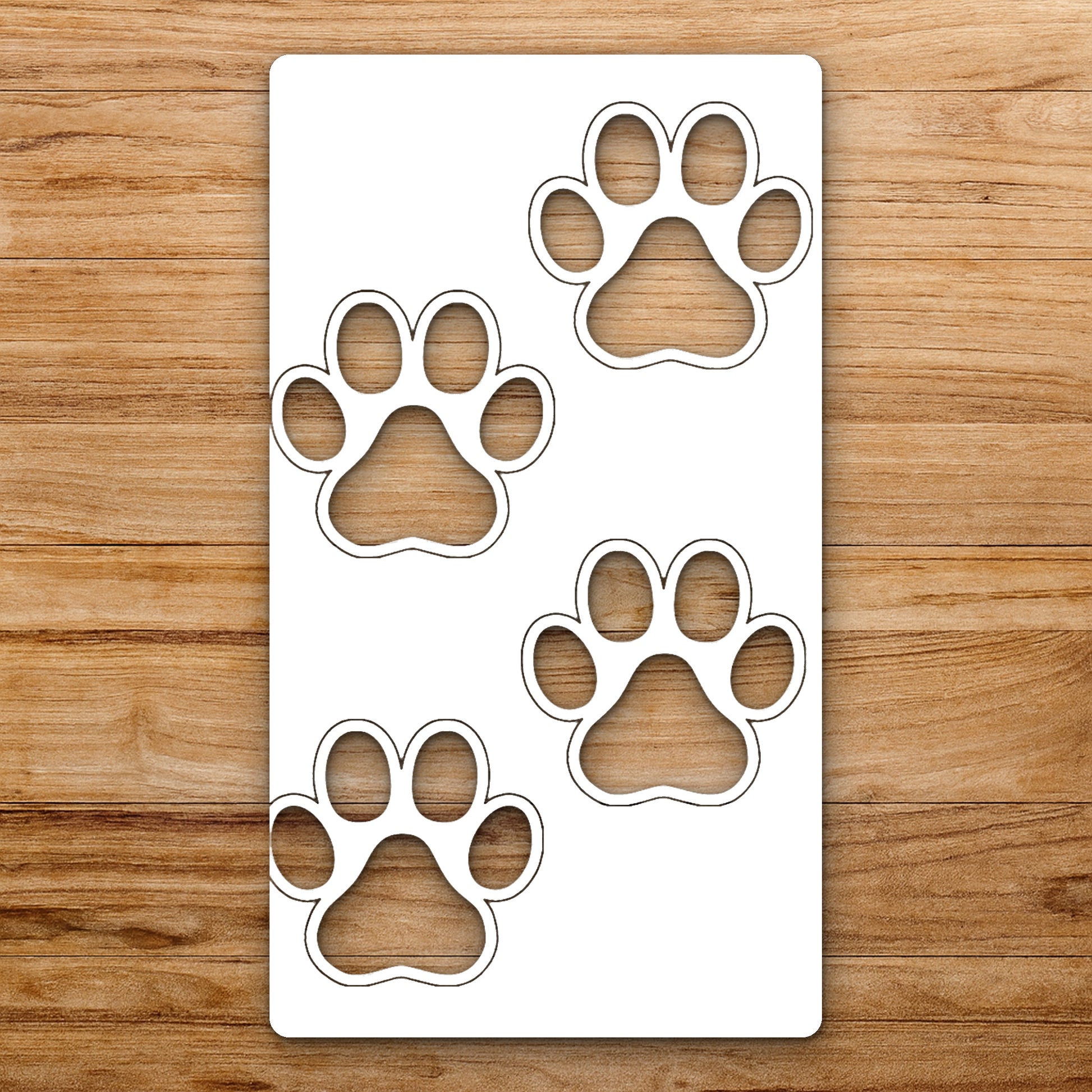 Four Paw Prints Arranged In Scattered reusable Mylar wall painting stencil